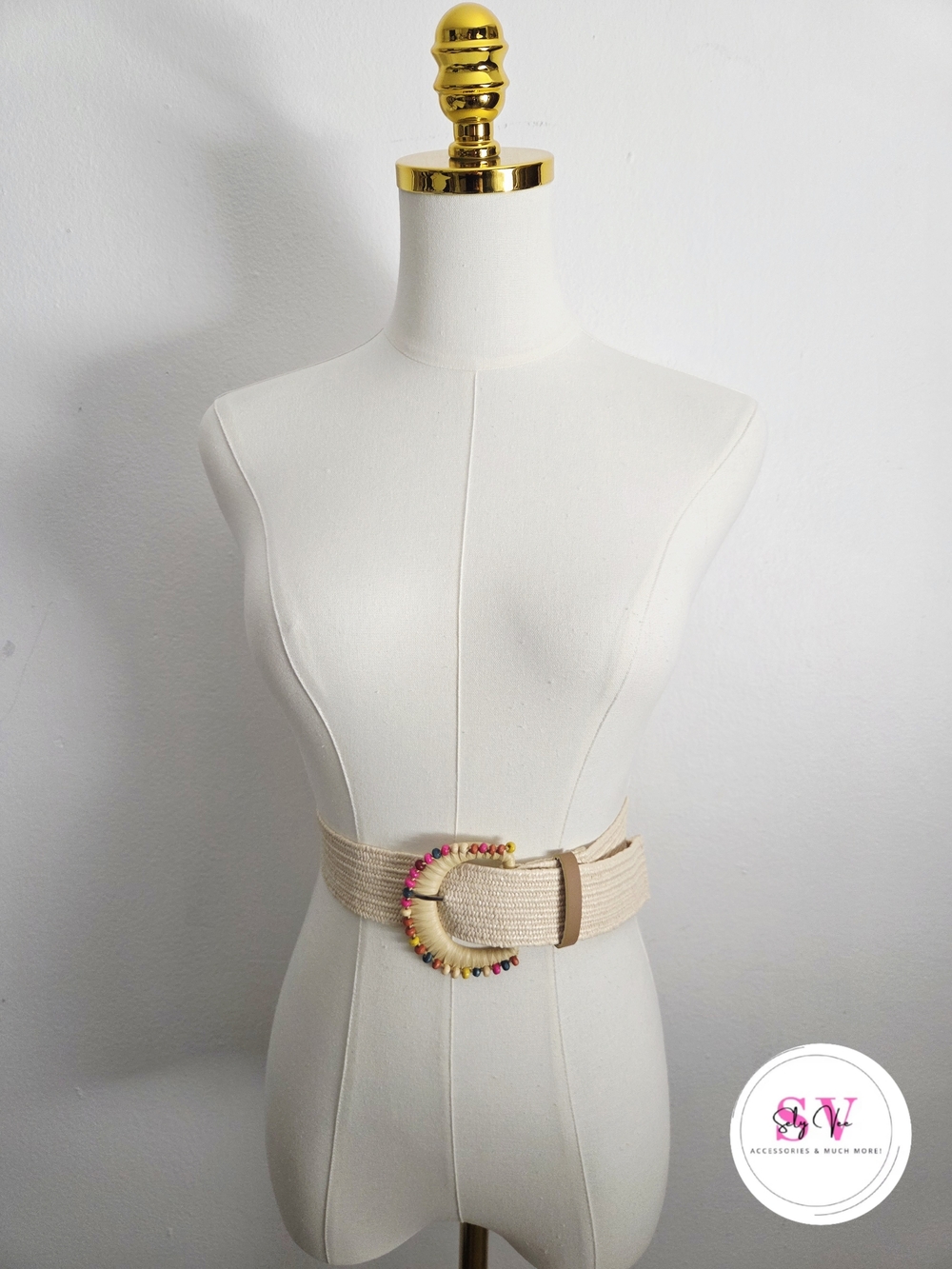 Stretchy Cream woven belt with multicolored bead detailing on the buckle